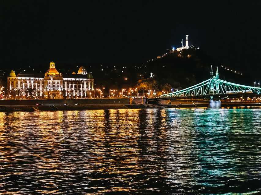 Budapest: City Highlights Cruise with Welcome Drink - Passing The Hungarian Parliament Building After Dark