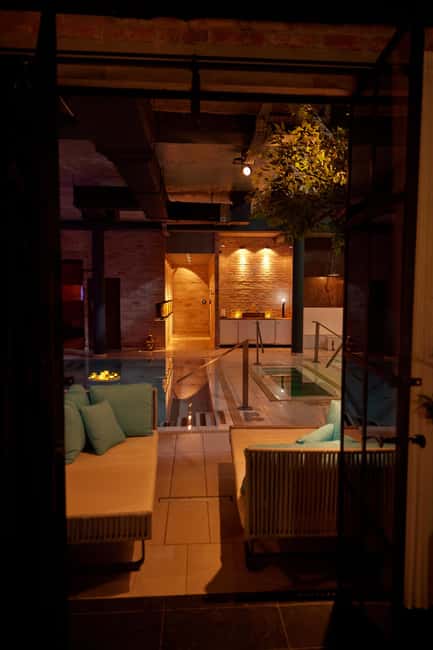 Budapest: Massage 60/75/90 min +Unlimit Bath Mandala Day Spa - The relaxation section: heated marble bench, armchairs, and a buffet